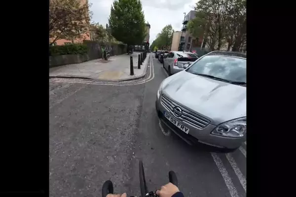Cyclist's Near-Collision Reflection, Tadej Pogačar's Crypto Partnership, and Criticized Cycle Lane Spark Debate
