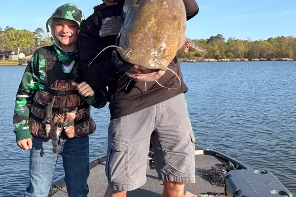 Young Angler's Near-Record Catfish Catch and the Guide's Insights on Flathead Behavior