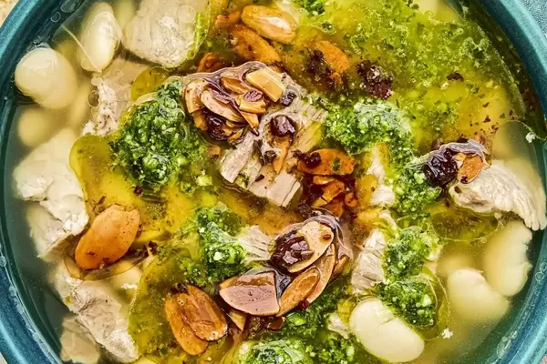 Mexican Brothy Beans with Pork, Salsa Macha, and Cilantro Pesto
