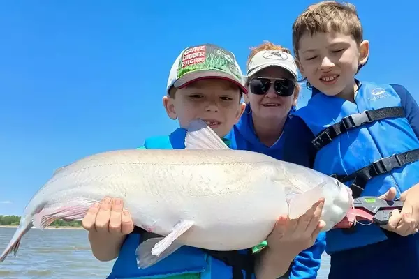 Young Anglers Land 50-Pound Catfish with Grandmother