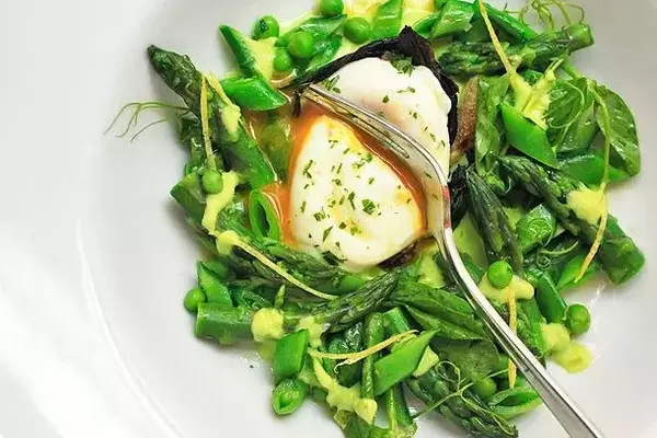 Crafting a Vibrant Spring Salad with Blanched Vegetables and Poached Eggs