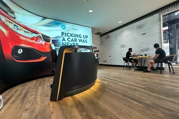 Carvana's Stock Dips Despite Record Quarter Amidst Disappointing Future Projections