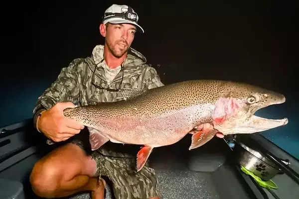 Angler's Triumph: The Elusive Giant Rainbow Trout Finally Caught at Night