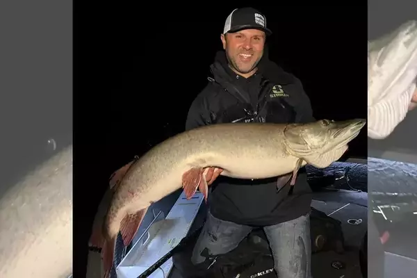 A beginner angler's first muskie catch turns out to be a massive 50-inch fish